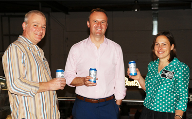 (l-r) Richard Watkins (BentSpoke co-owner and head brewer), Andrew Barr (ACT Chief Minister) and Tracy Margrain (co-owner and brewer) celebrate the launch of the BentSpoke Cannery